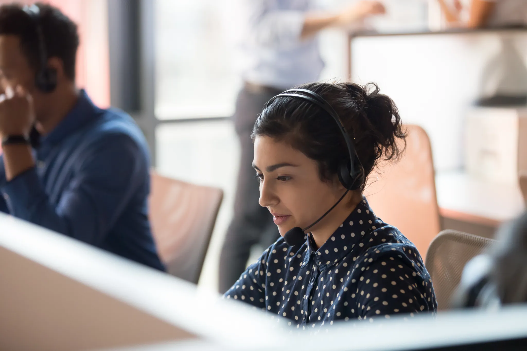 Agents on headset calls in a contact center