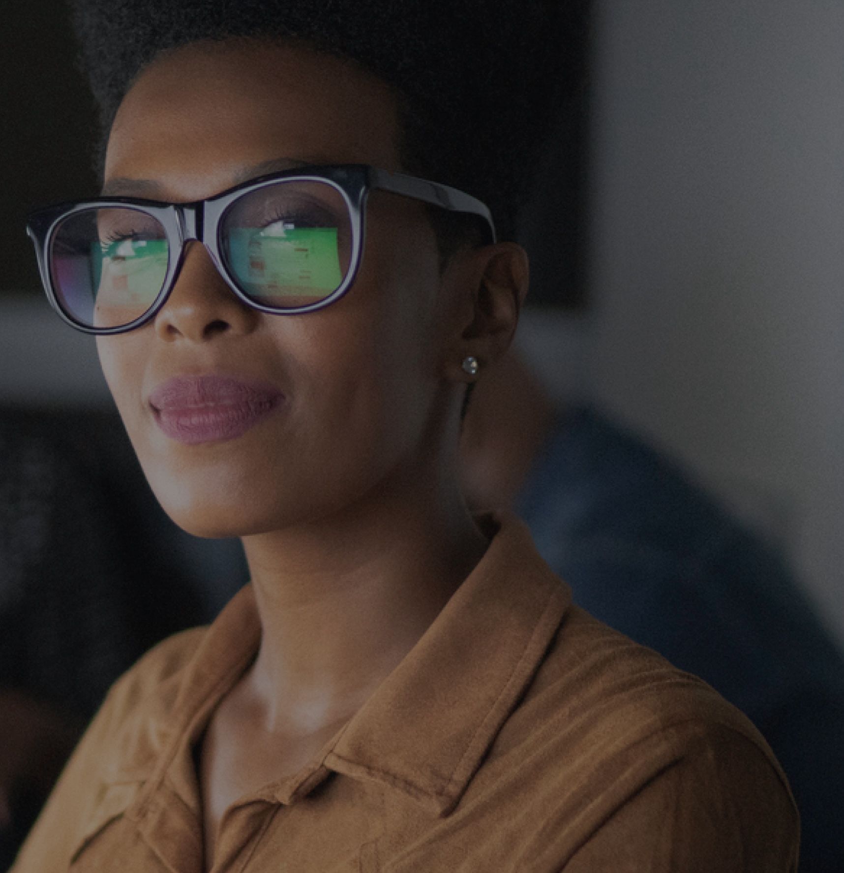 Customer looking at a computer screen while wearing glasses